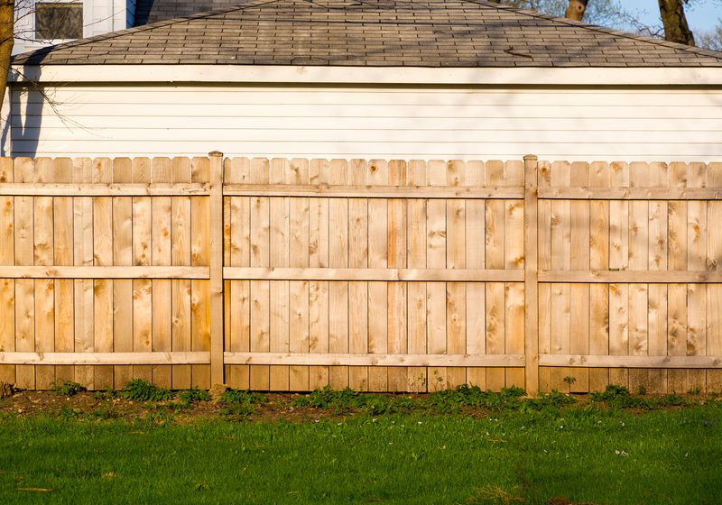 Wood privacy fence installation
